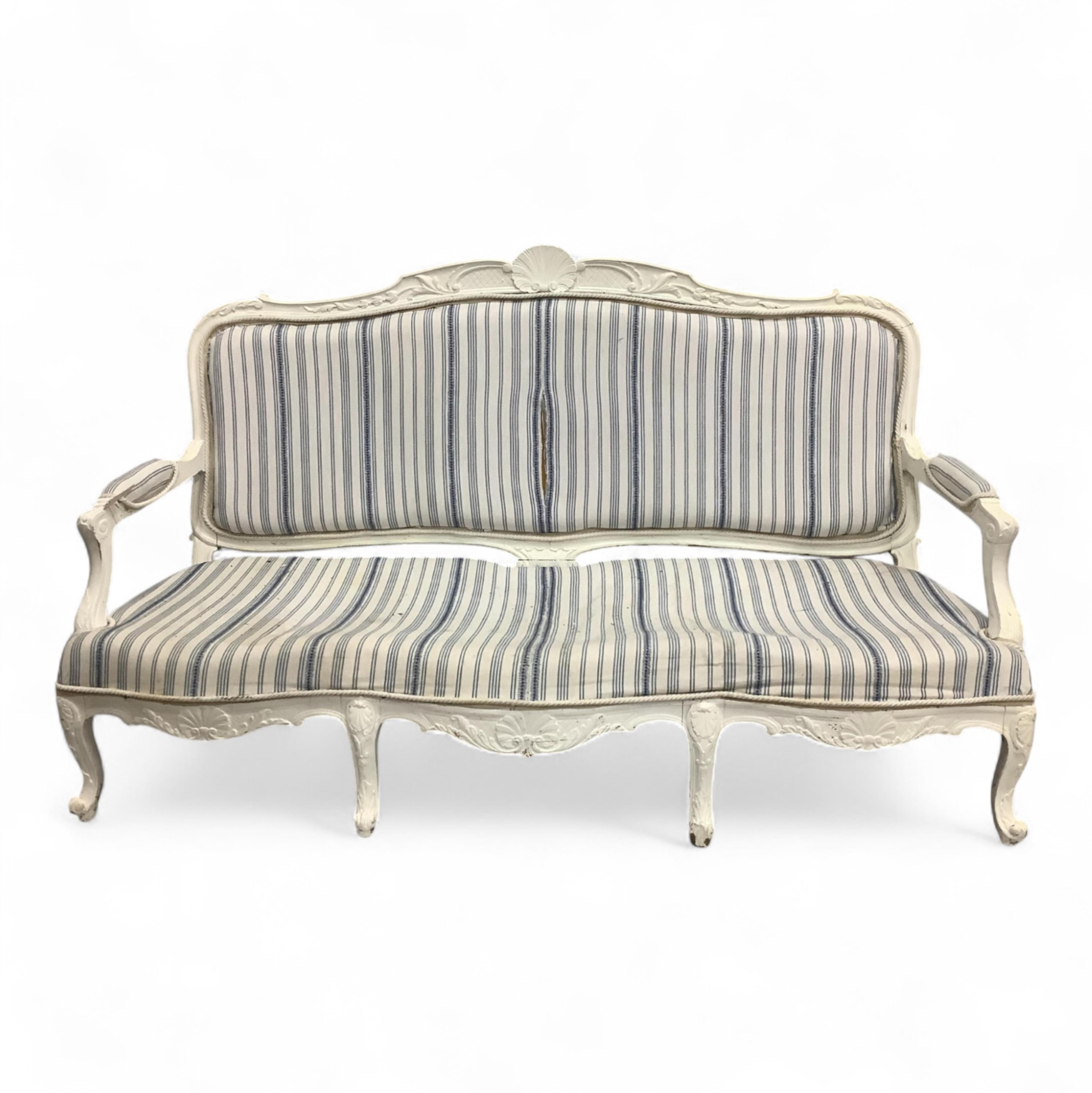 A Louis XVI style painted upholstered settee, width 180cm, depth 66cm, height 98cm. Condition - fair, upholstery poor